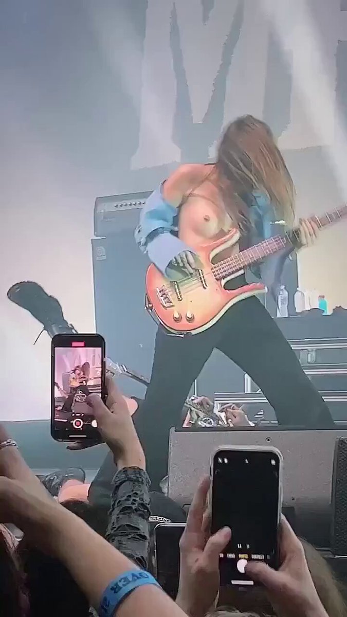 Concert-stage hot girl plays guitar bare-chested! Long-haired beauty exposes breasts and shakes her hips in a wild performance