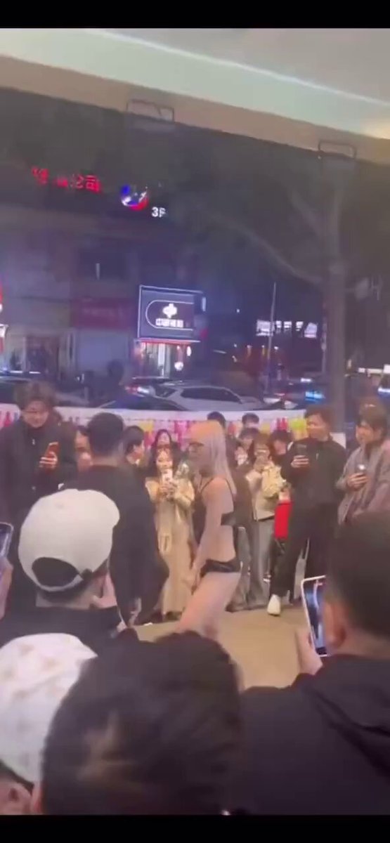 Blonde street slut in thong watches group orgy!