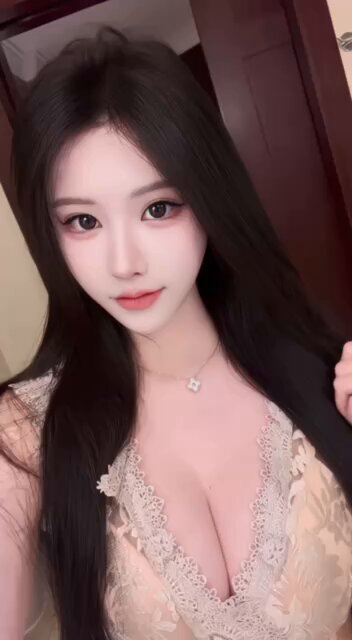 Black long-straight beauty in the bathroom with a plunging V and busty tease — huge breasts bouncing seductively!