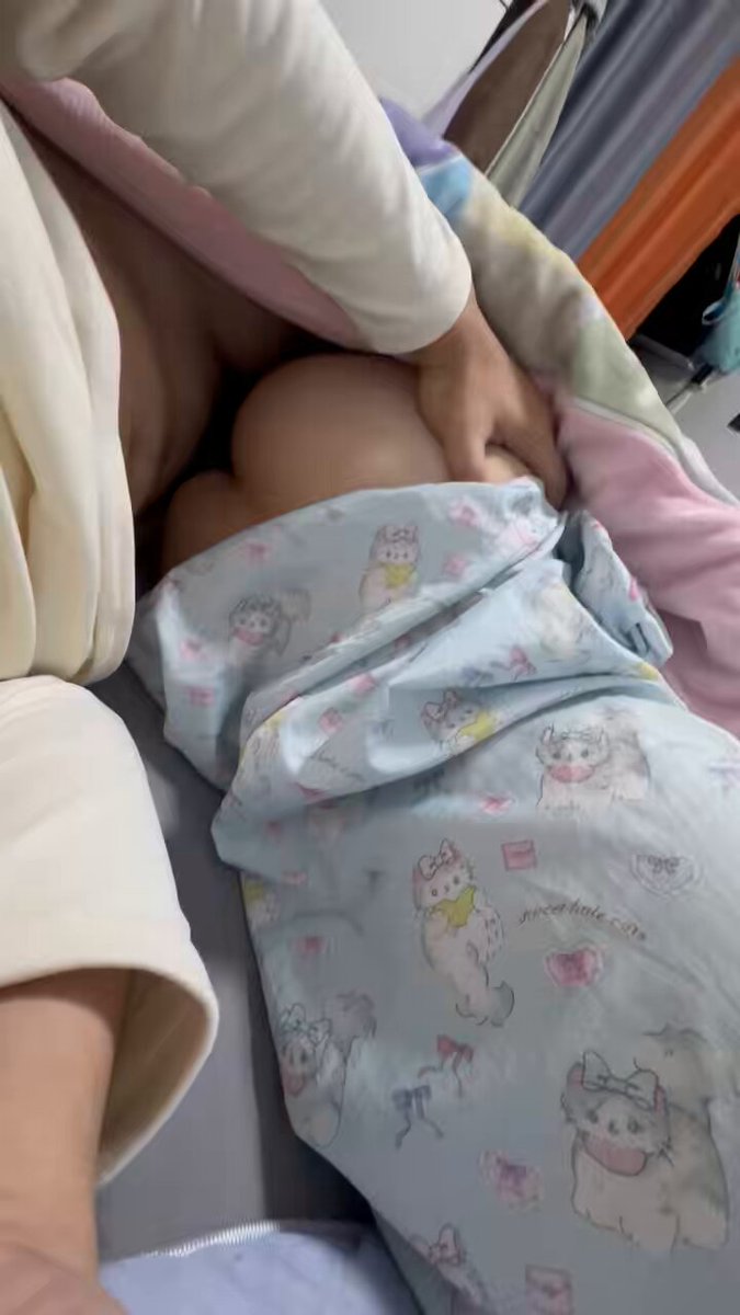 Cute by the baby crib lifts her skirt to expose her butt — tempting pink butt close-up