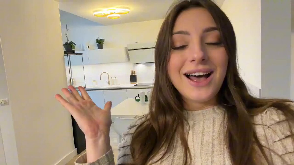 Busty Kitchen Beauty Chats and Flirts — Apron Tease with Her Big Breasts Jiggling