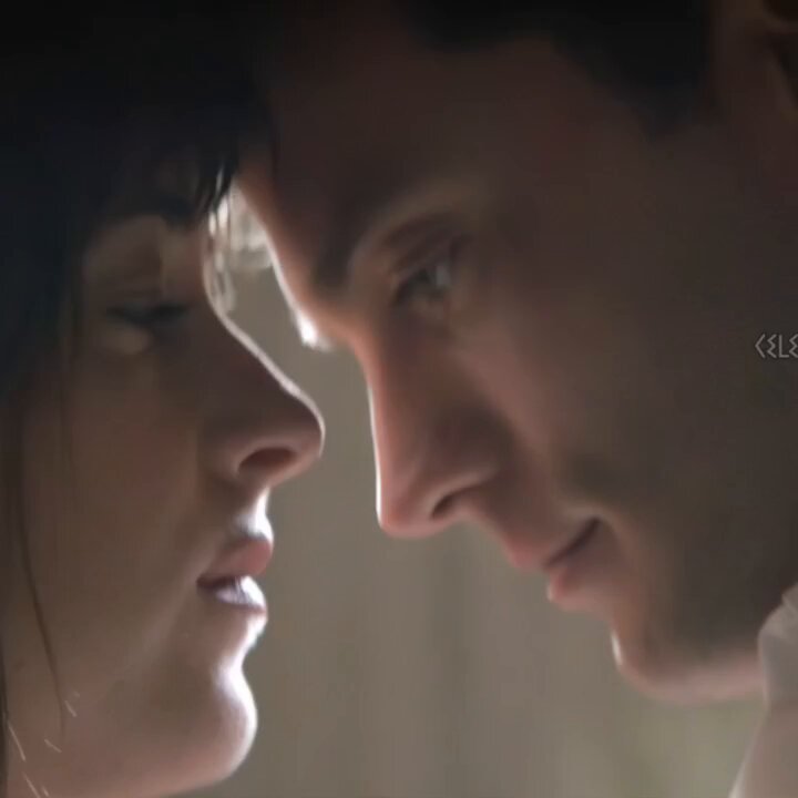 Naked Woman on Bed in Passionate Embrace — Man Frenziedly Licks Her Breasts, Wet Kisses and Heated Caresses