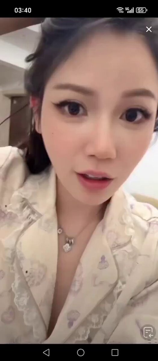 Sexy Woman in Silk Nightgown Selfie Tease — Deep V Cleavage Shows Off Beautiful Legs