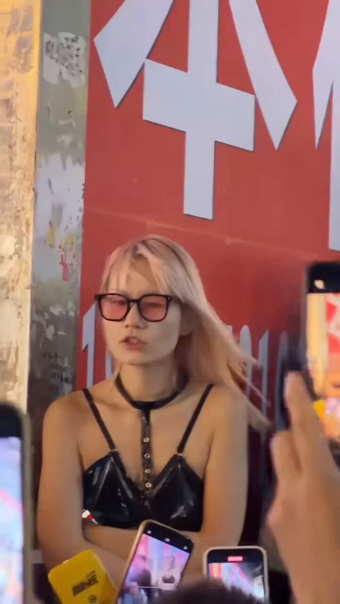 Blonde Bombshell in Black Latex Shows Deep-Plunge Cleavage! Fans Snap Photos of Her Big-Breast Tease on the Street