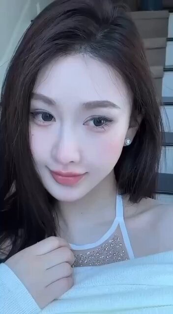 Sexy Fox-like Beauty in a Deep-V Sheer Outfit Teasing Herself