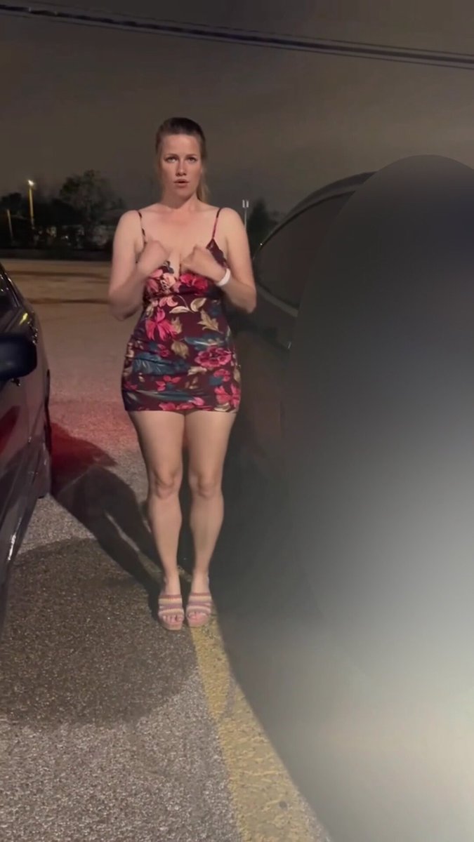 Horny slut strips naked and runs wild in a parking lot at night! Big breasts and fat ass fully exposed begging to be fucked