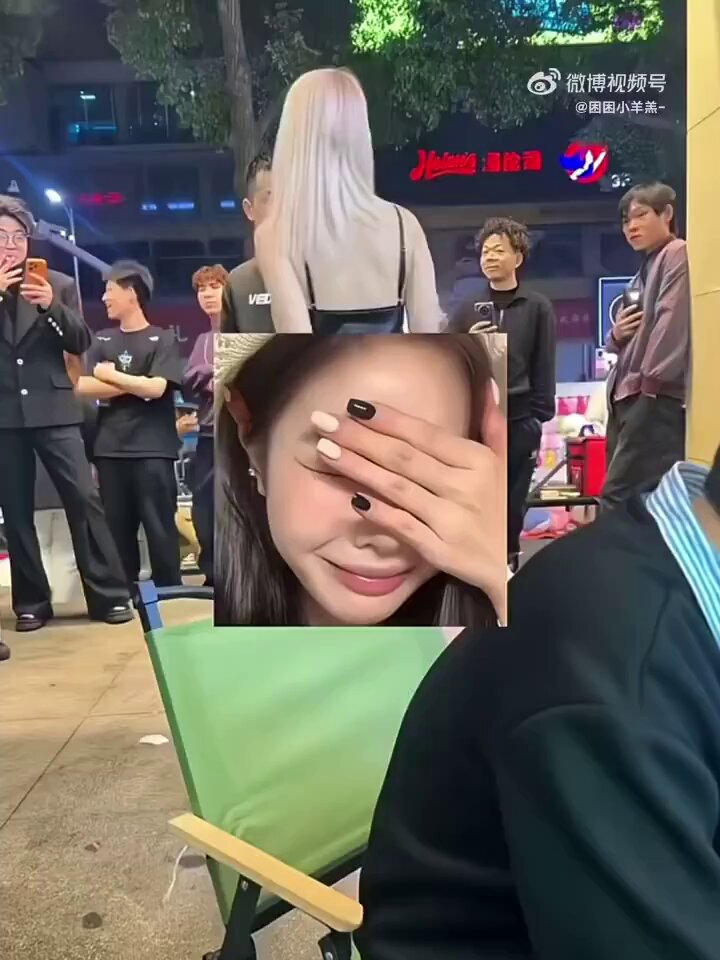 Pink-haired street slut flashes her breasts and is groped by onlookers — fans wildly film the lewd scene