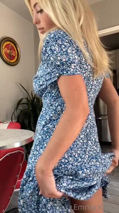 Blonde beauty lifts her skirt in the kitchen, flashing a huge perky butt and big breasts!