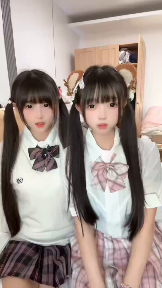 Twin long black straight-haired women (adults)! JK-style uniform tease, short skirt and perky butt on display!