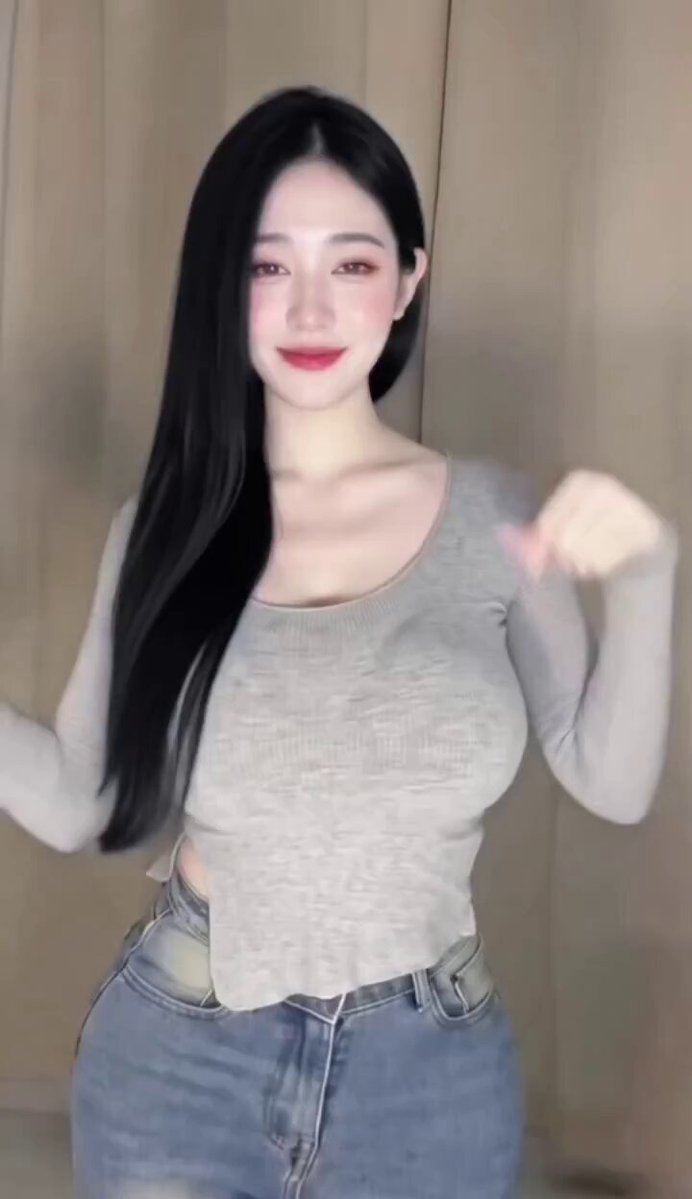 Busty Long-Straight-Haired Beauty in Gray Tee and Jeans Teases with Hot Dance — Perky Butt and Big Breasts Jiggle!