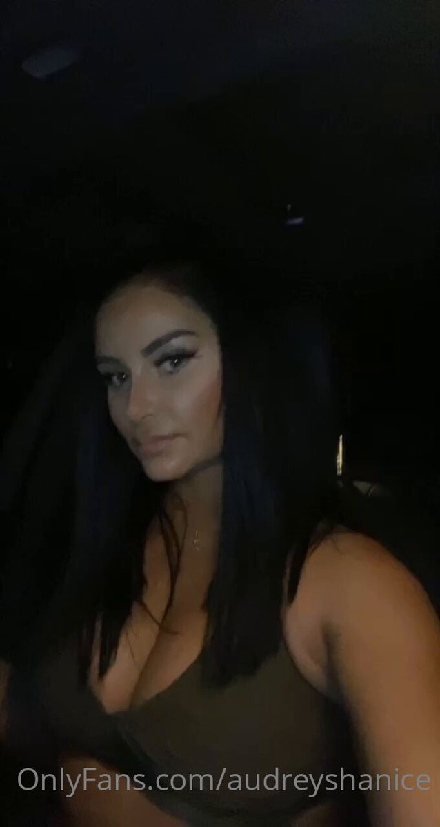 Busty beauty Audrey Shanice opens the door to seduce you — deep-V cleavage jiggling, waiting for you to fuck!