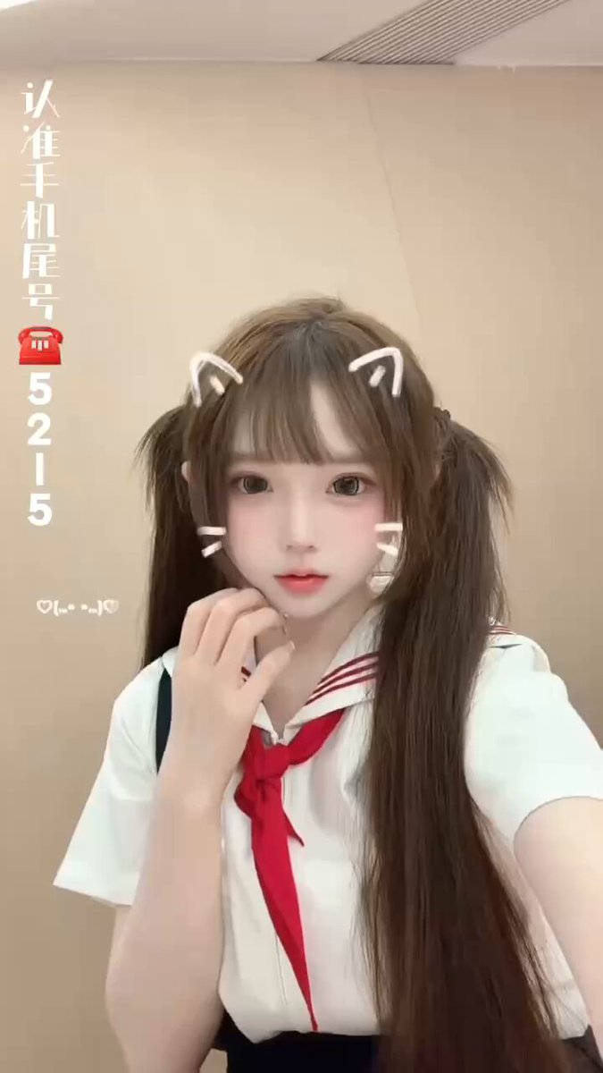 Cat‑ear girl in sailor uniform selfie — cute twin‑tail JK cosplay