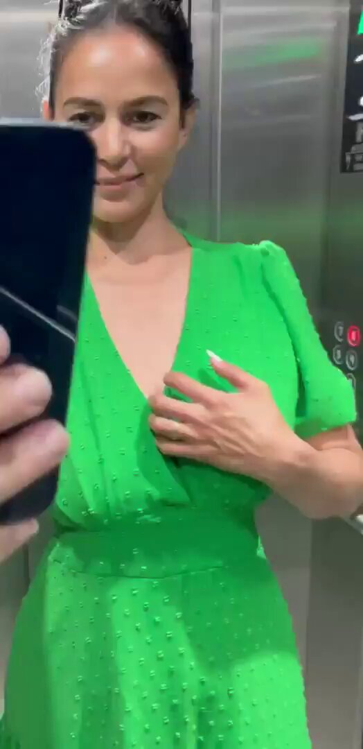 Green Dress Beauty in Elevator Boldly Exposes Breasts and Self-Stimulates Her Big Boobs