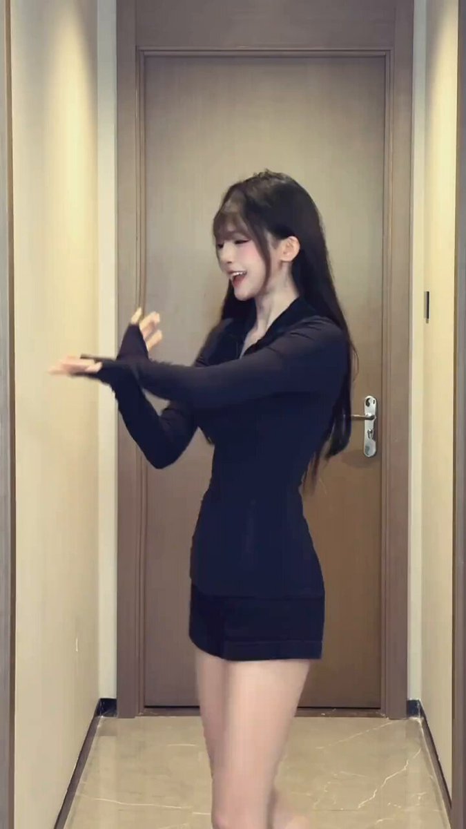 Black-Clad Long-Legged Beauty Teases in Corridor with a Hot Dance — Perky Butt and Mesmerizing Leg Poses!