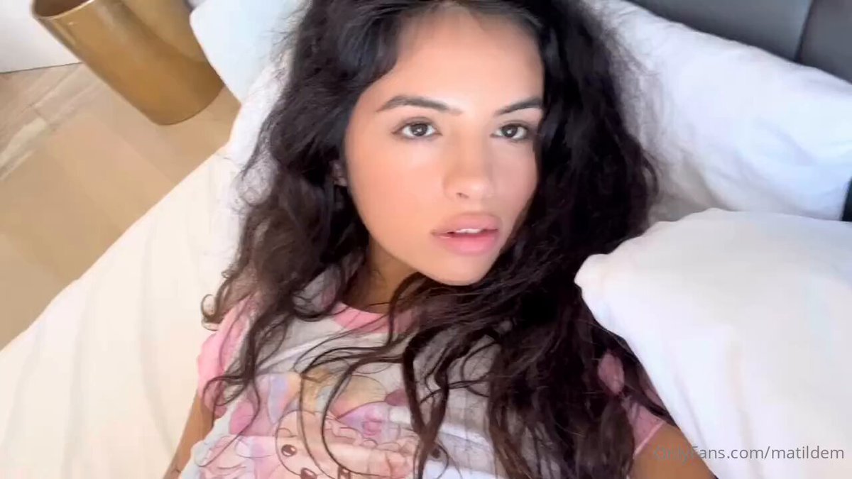 Black-haired beauty in a pink nightgown masturbates on the bed, wand thrusts into wet pussy, squirting orgasm!