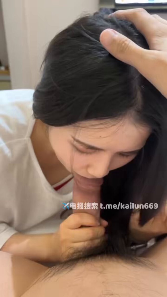 Black‑haired beauty deep‑throats and swallows cum, hungrily sucking a big cock on a hotel bed