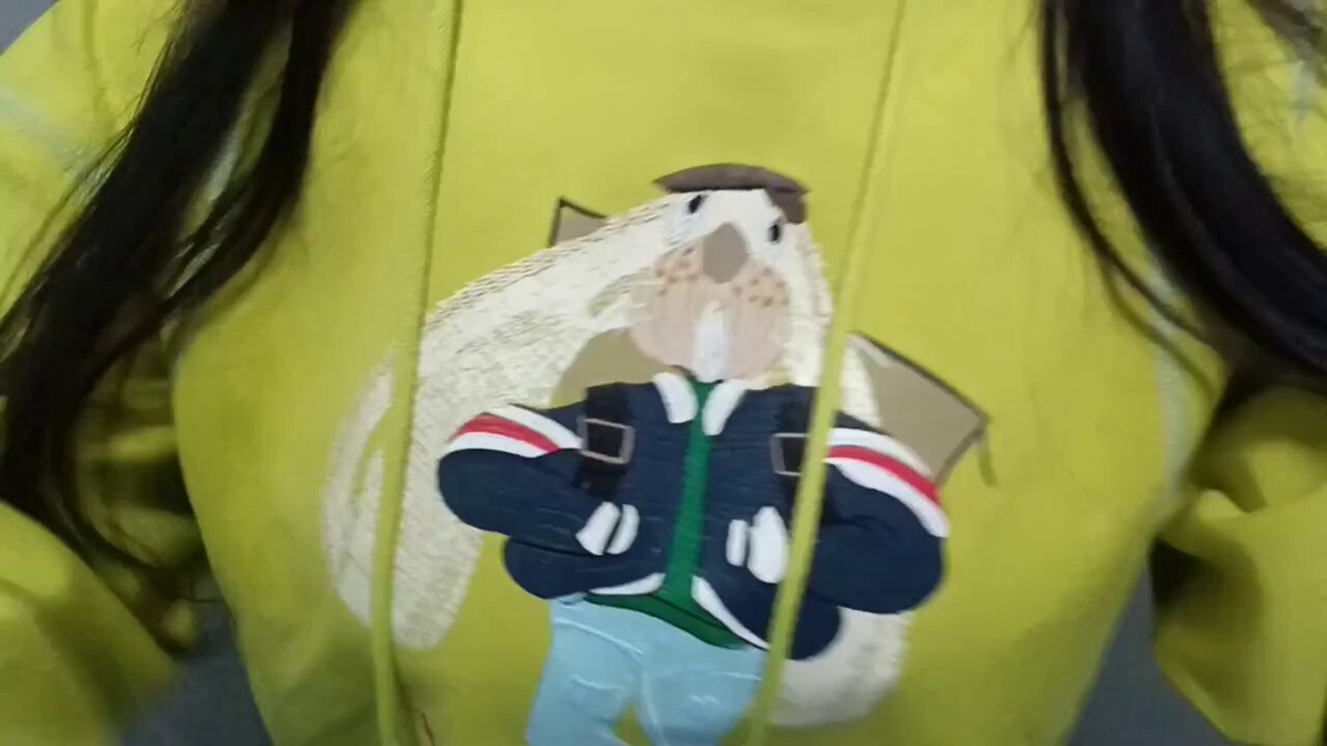 Busty Beauty in a Green Hoodie and White Shirt – Tempting Breast Squeeze