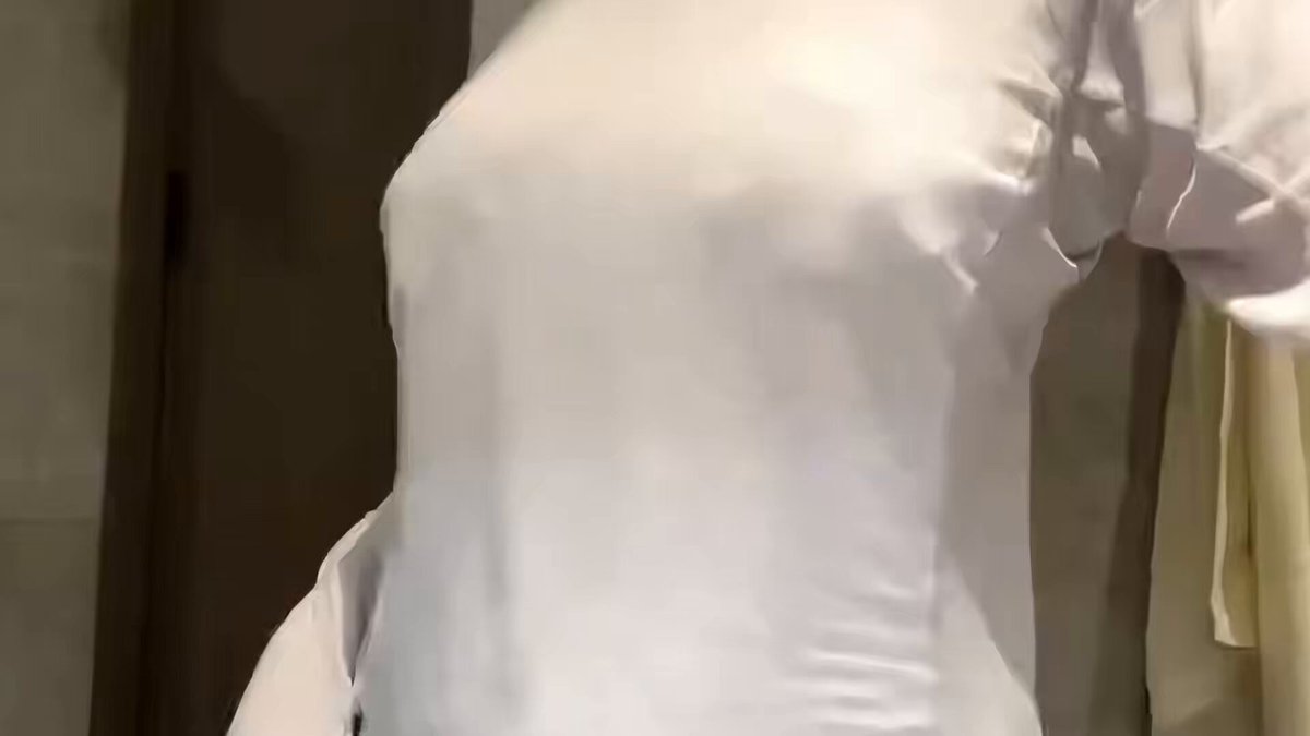 Busty girl in white reveals her breasts in the bathroom — her boobs bounce seductively!