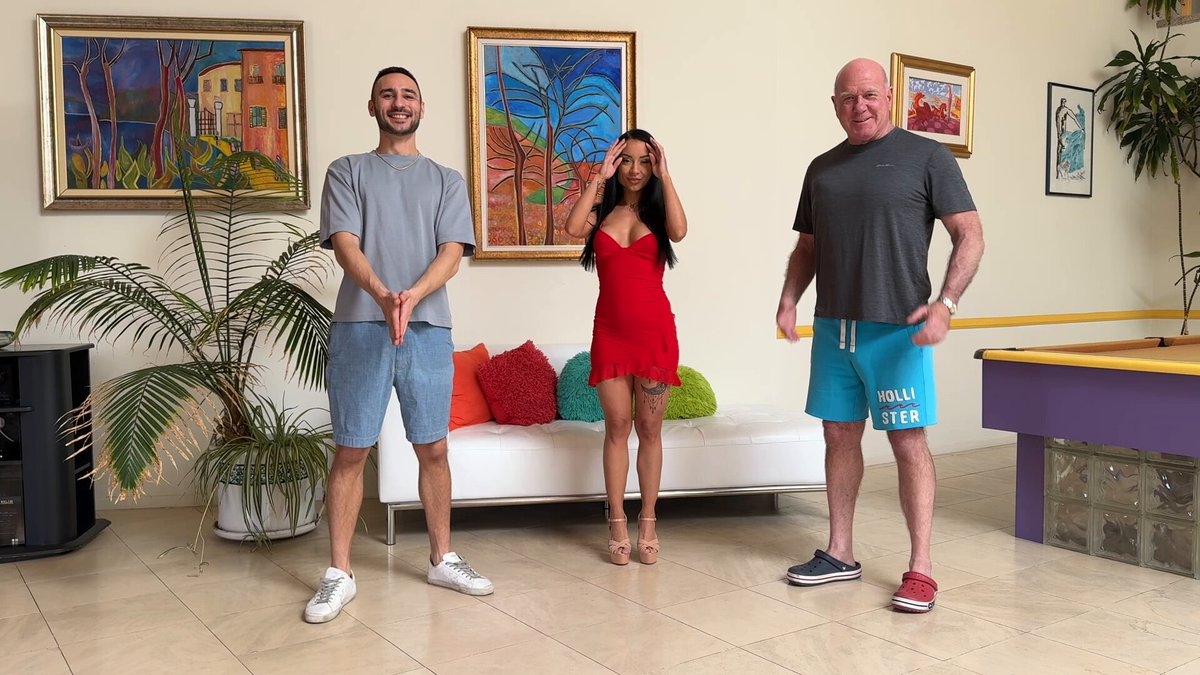 Red-dress hottie tempts two men with a steamy dance! Perky butt sways, ready for a 3P frenzy