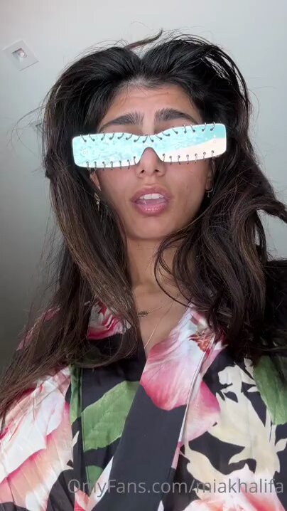 Tattooed Babe Mia Khalifa by the Pool Strips and Sensually Shakes Her Perky Butt and Big Breasts