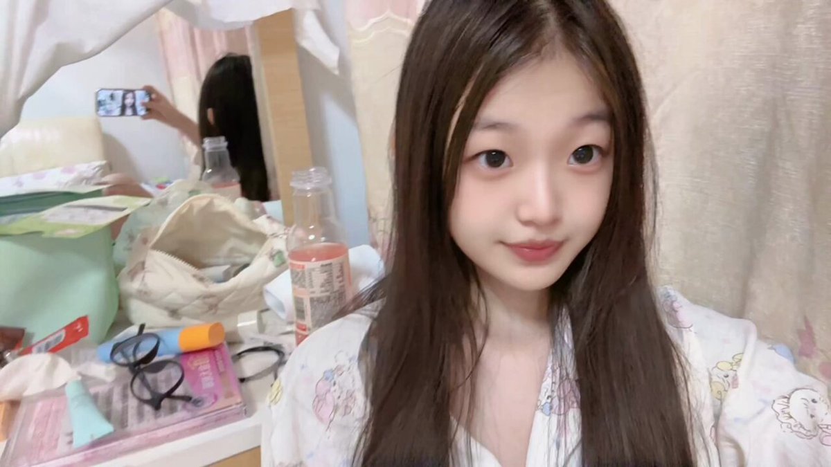 Cute girl opens her bathrobe and masturbates her pink pussy, squirting at orgasm