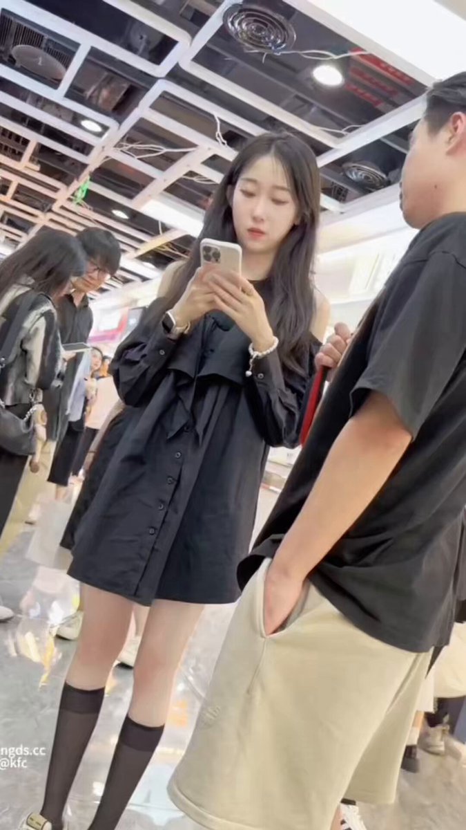 KFC Mall Beauty in Black Stockings Lifts Skirt, Exposing White Panties Up Close!