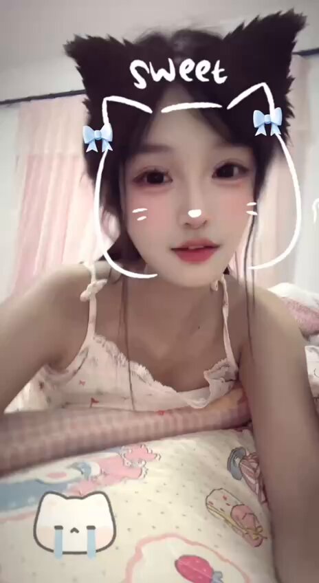 Sweet catgirl in a pink nightdress seduces in a selfie, her soft pink ample breasts about to spill out!