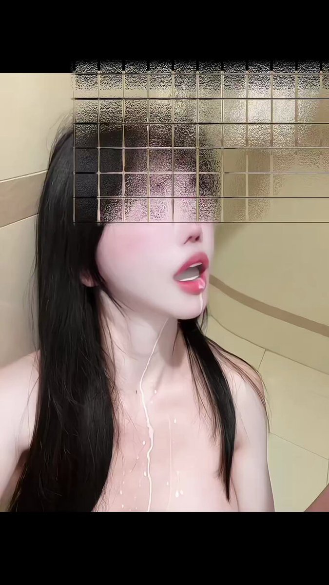 Long-haired beauty in the bathroom opens her mouth and squirts milky fluid! White cloudy liquid gushes over her chest, overflowing with temptation