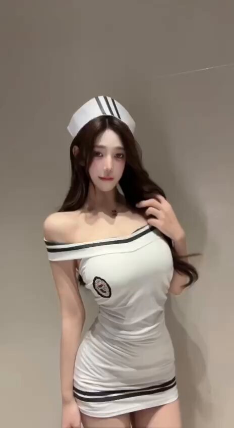 Sexy nurse babe in an ultra-tight white-stocking nurse outfit tempts and seduces — big breasts and a perky butt sway and squirt!