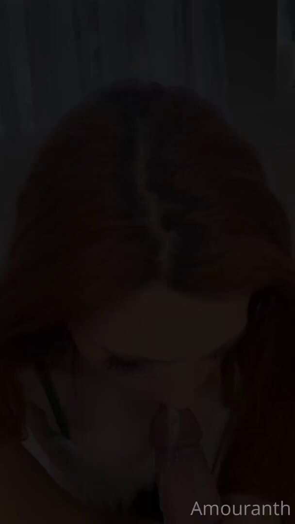 Red-haired slut Amouranth furiously licks a giant dildo and finishes with a facial orgasm