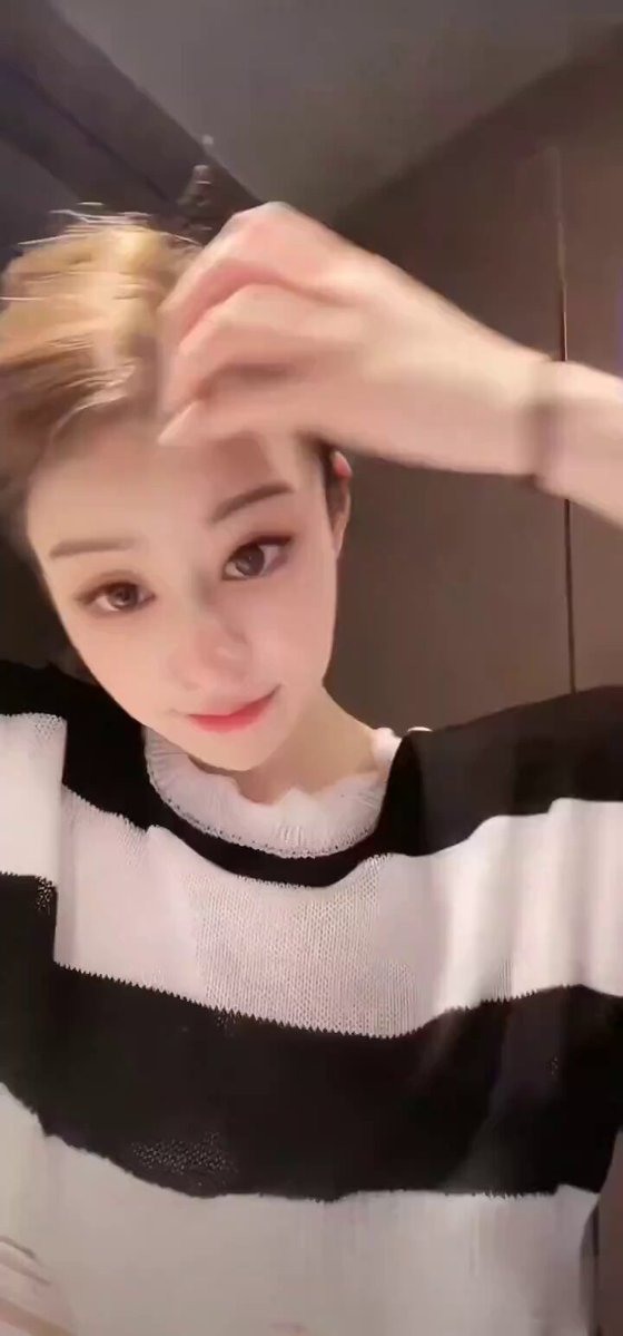 Bathroom slut rips black-and-white striped shirt to reveal huge breasts and teases with self-touch!