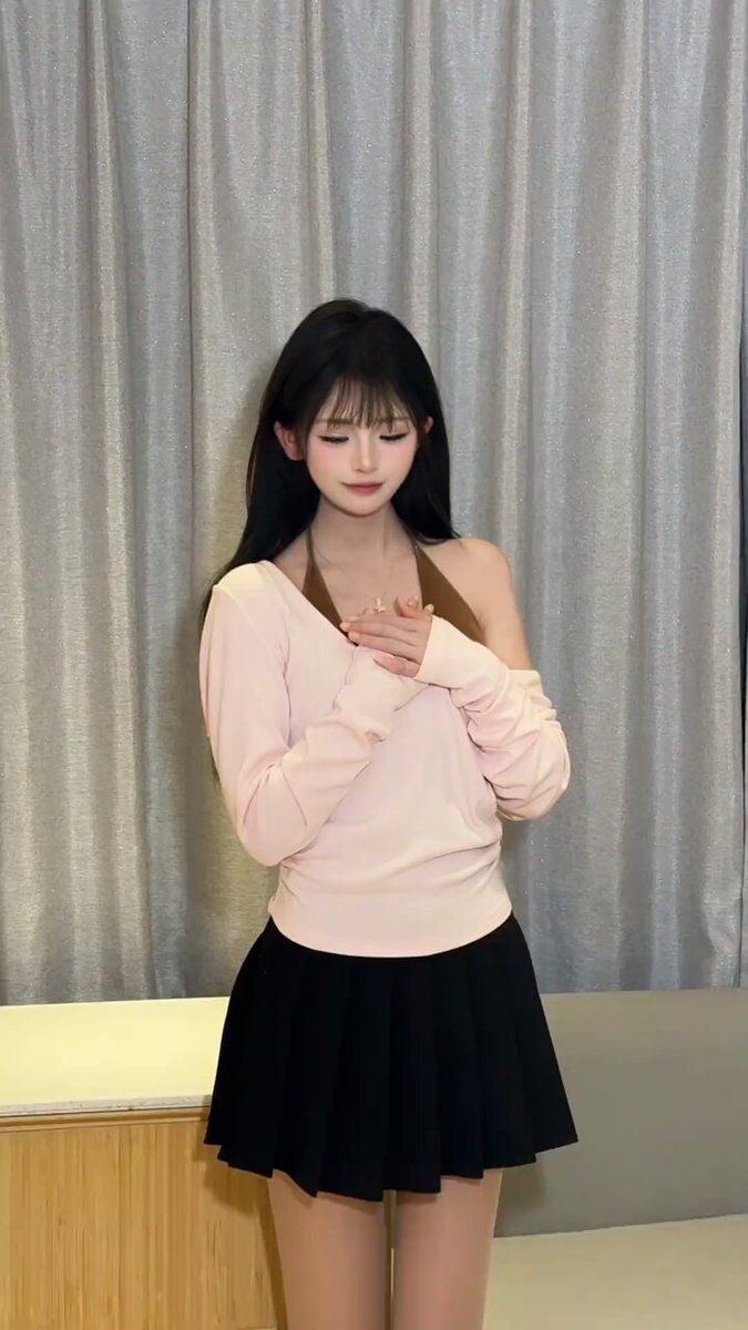 Long straight black-haired beauty in a pink off-shoulder top + black mini skirt seductively twists her waist, breasts bouncing and incredibly teasing!