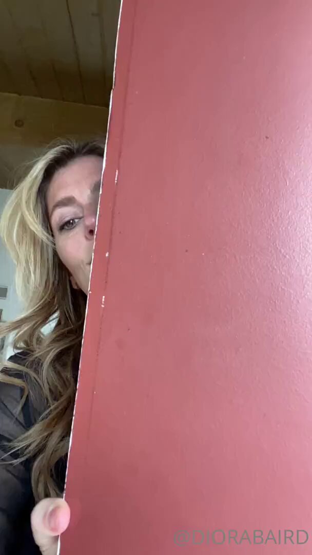 Busty Blonde DoraBaird Flashes Her Breasts Behind the Door!