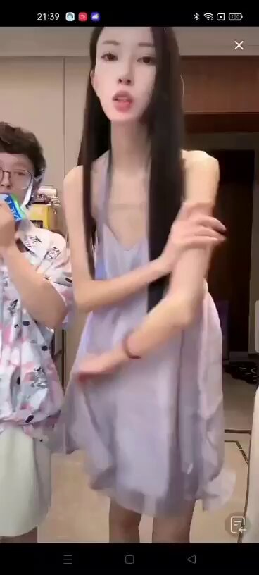 Long-legged beauty in a sheer nightgown seductively writhes and shows off her figure!